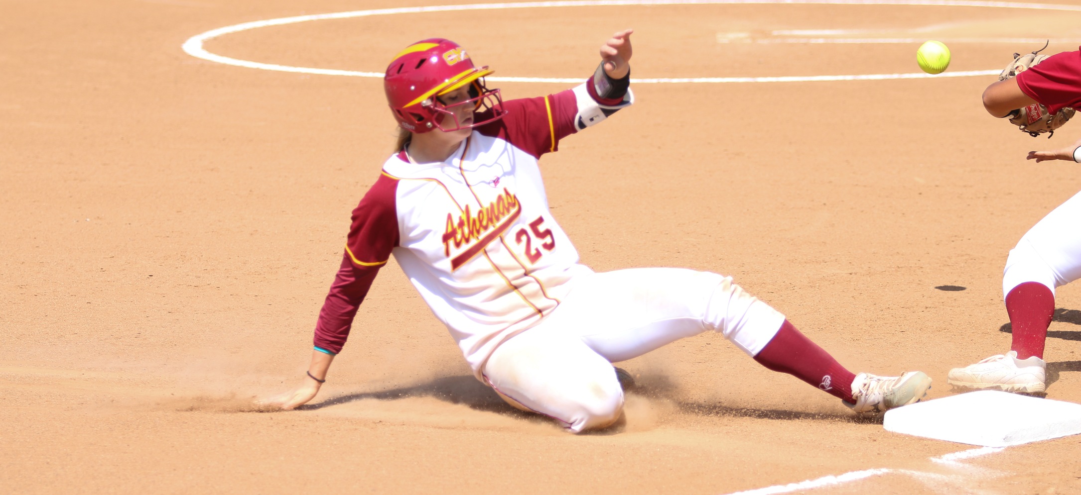 Carly Roleder (CMC) slides into third in Friday's game against Chapman. (photo credit: Matthew Fenton)