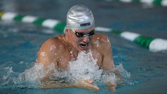 Sam Willett swimming the breaststroke at the SCIAC Championships