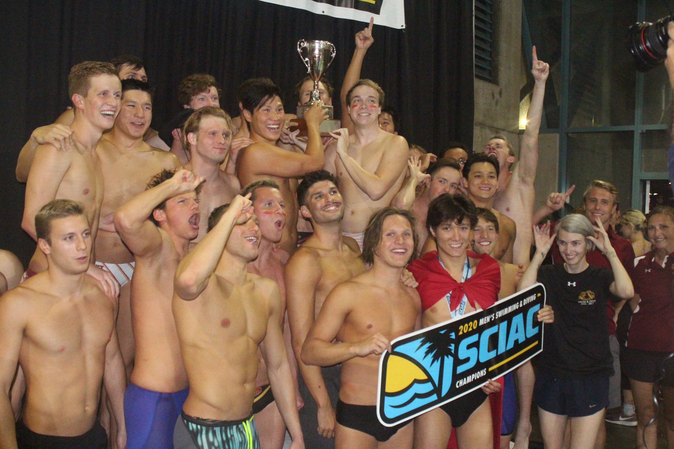 CMS Men's Swimming and Diving celebrating the 2020 SCIAC title