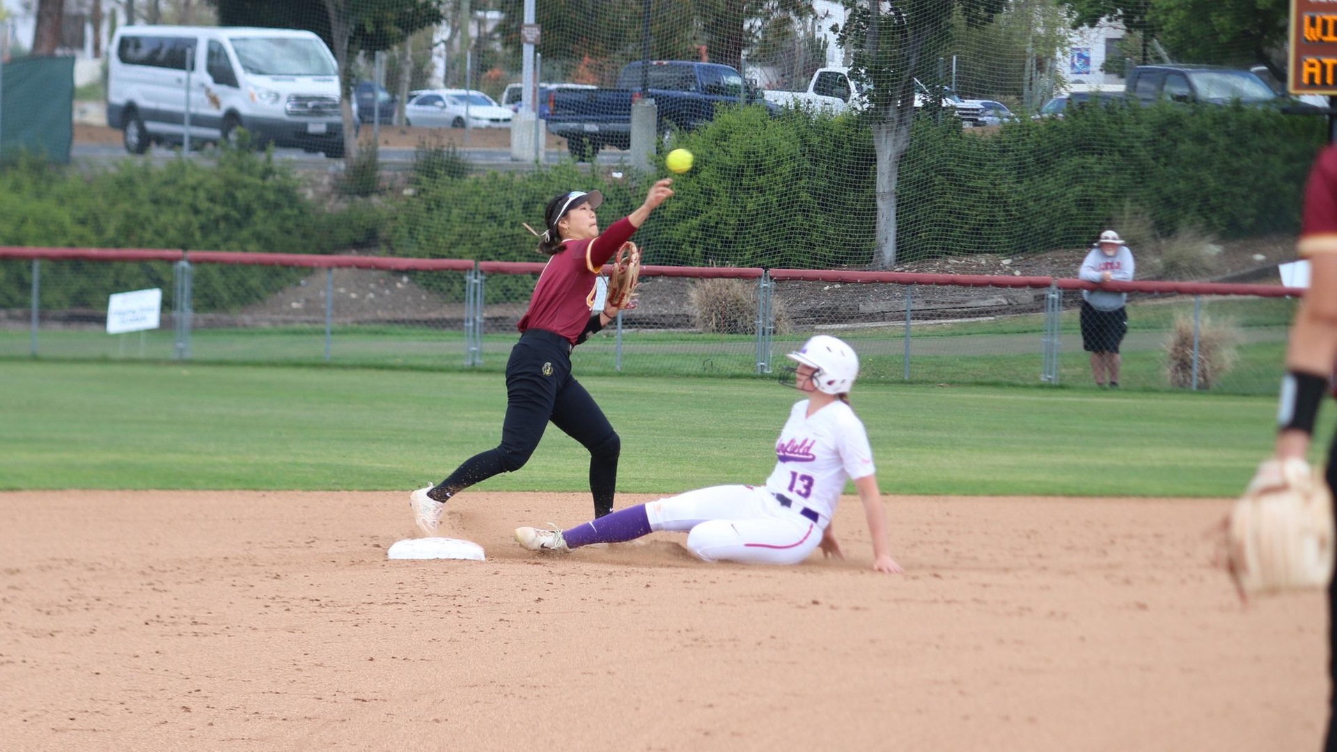 Emma Suh turns a double play for CMS in the opener (photo by Abbie Bobeck)