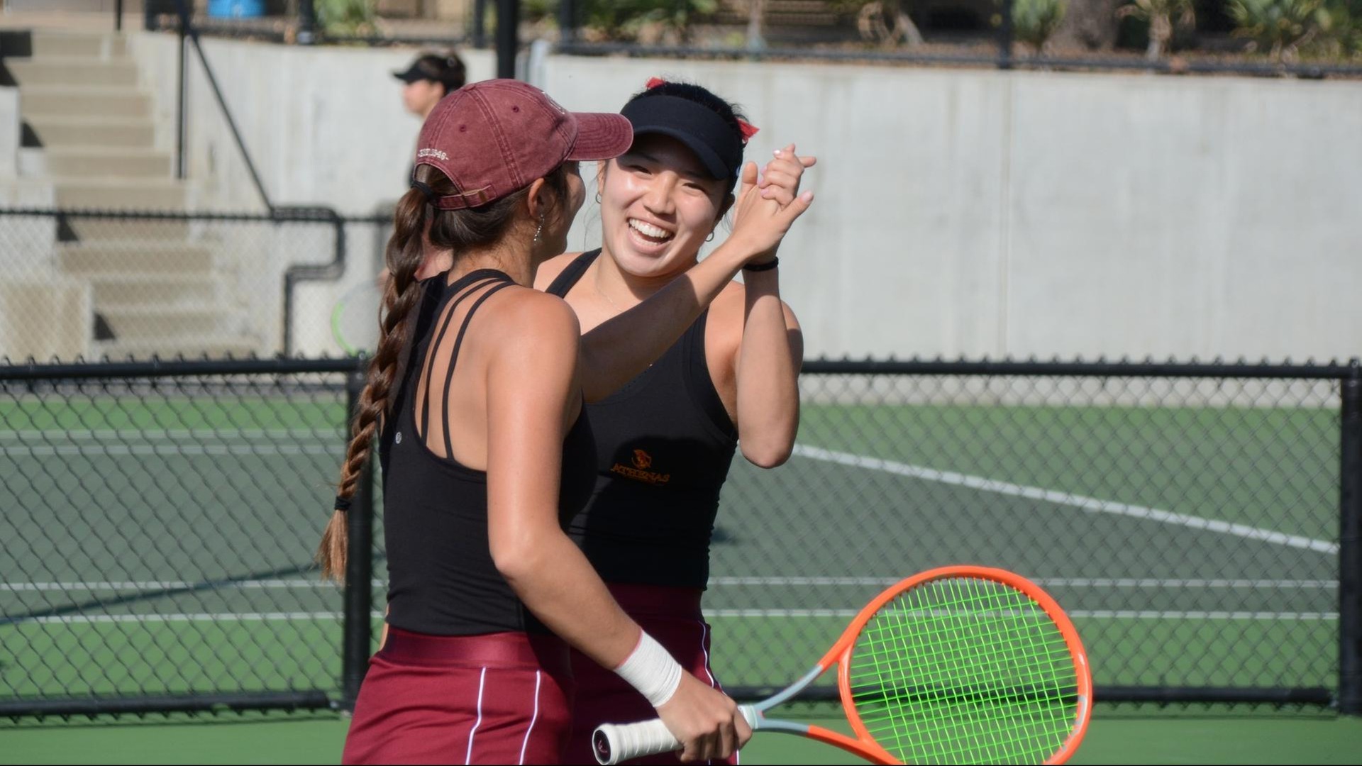Sydney Lee and Gabby Lee celebrate a doubles point