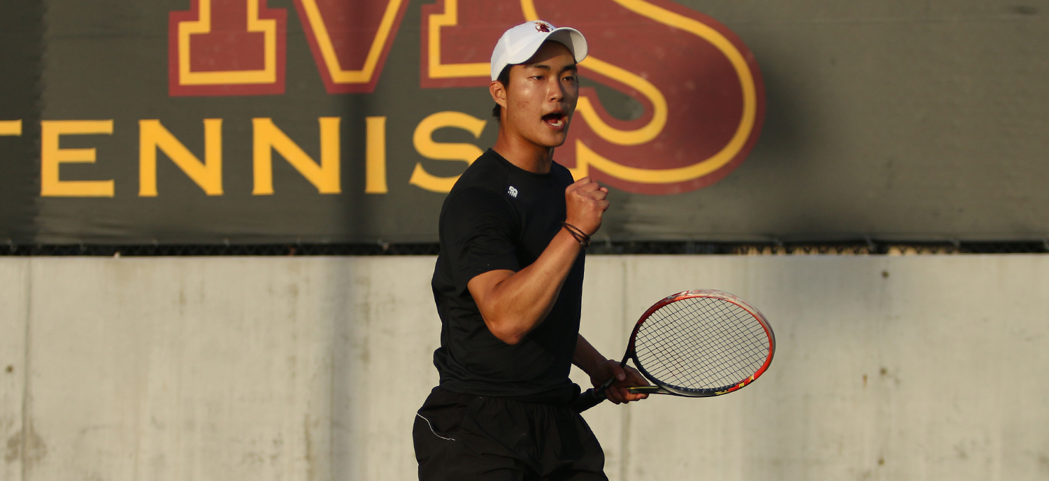Robert Liu celebrates after his doubles victory in the #3 match.