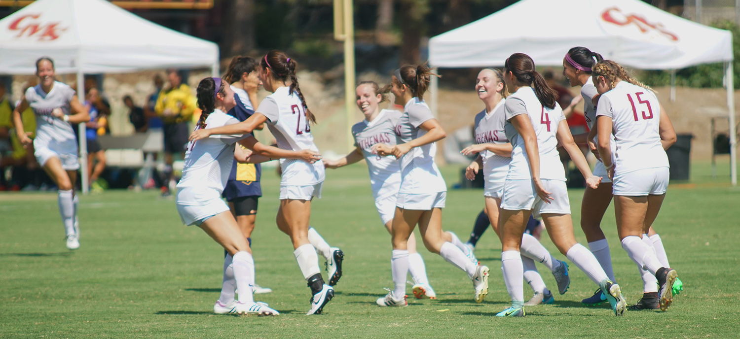 The Athenas celebrate after one of their five goals.
