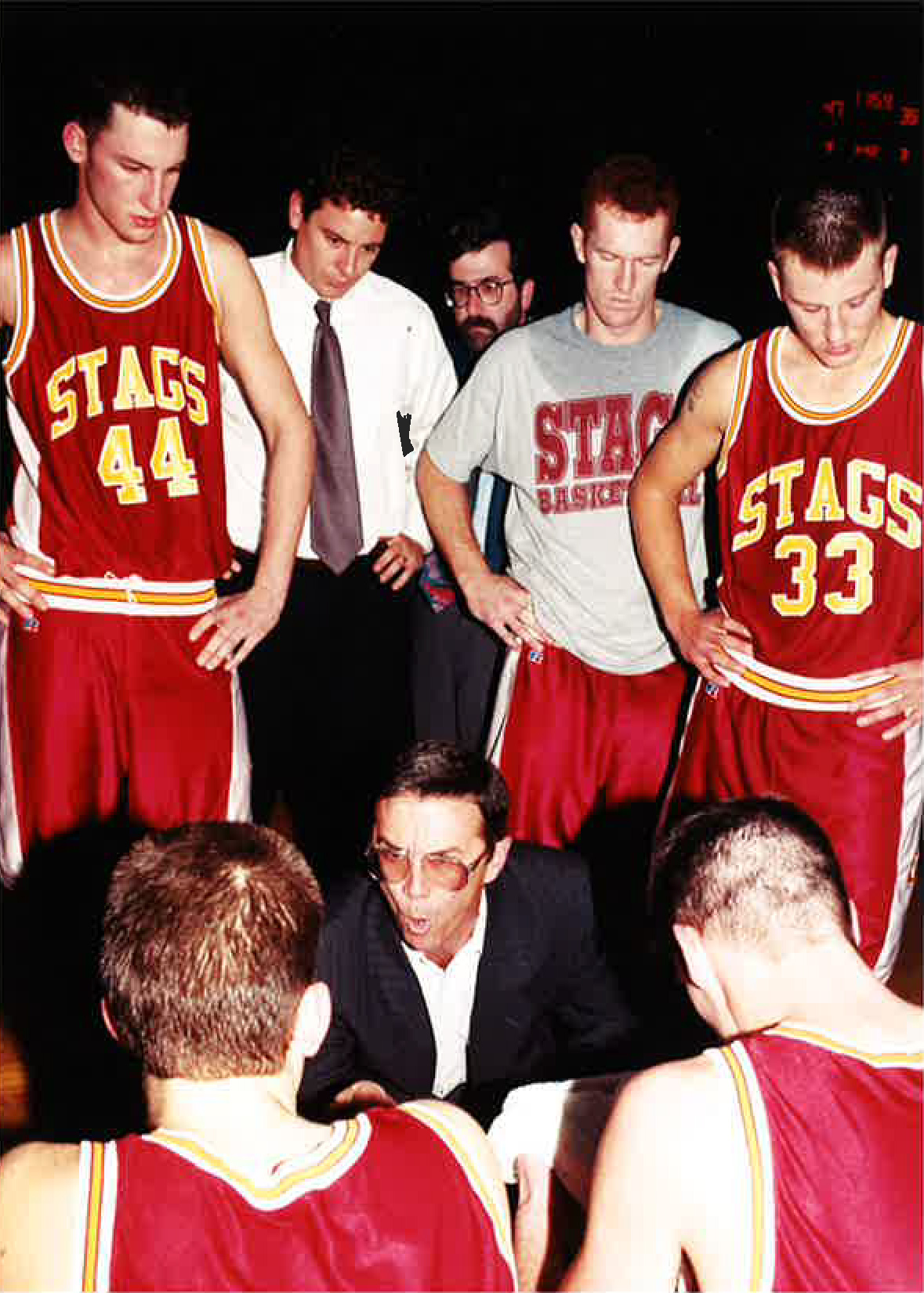 David Wells coaching in a team huddle