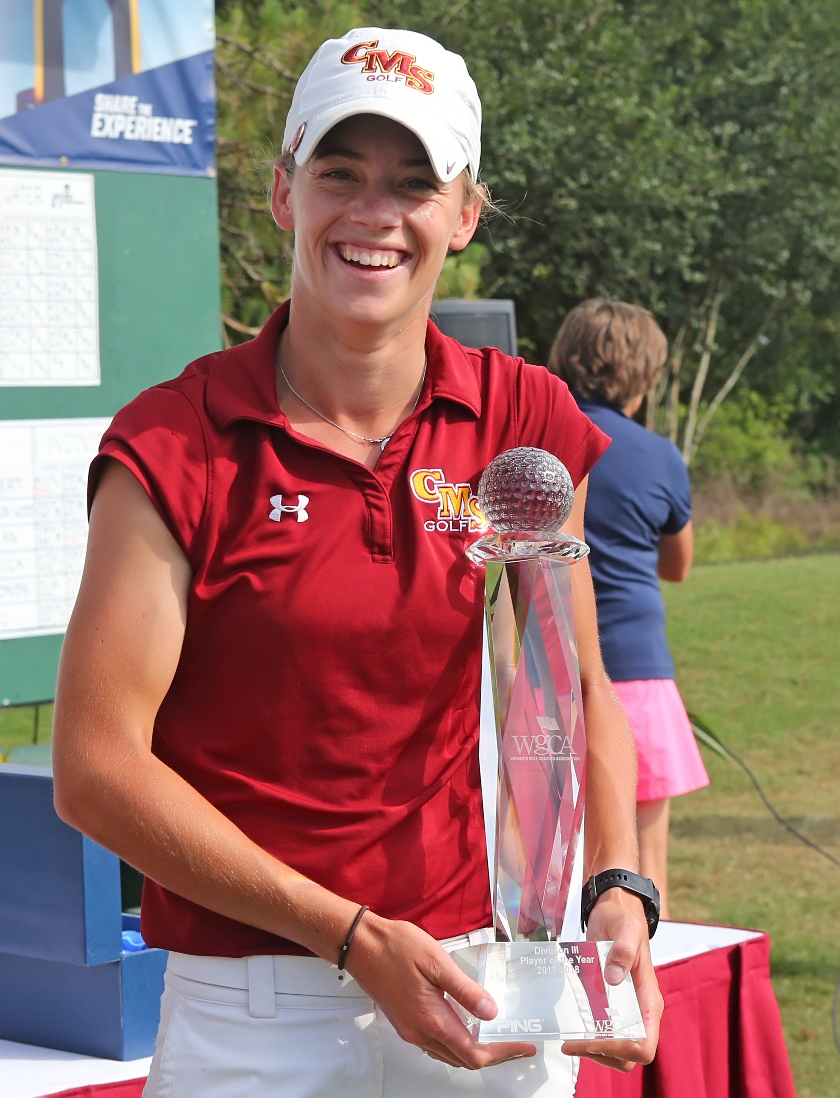 Margaret Loncki with the individual championship trophy
