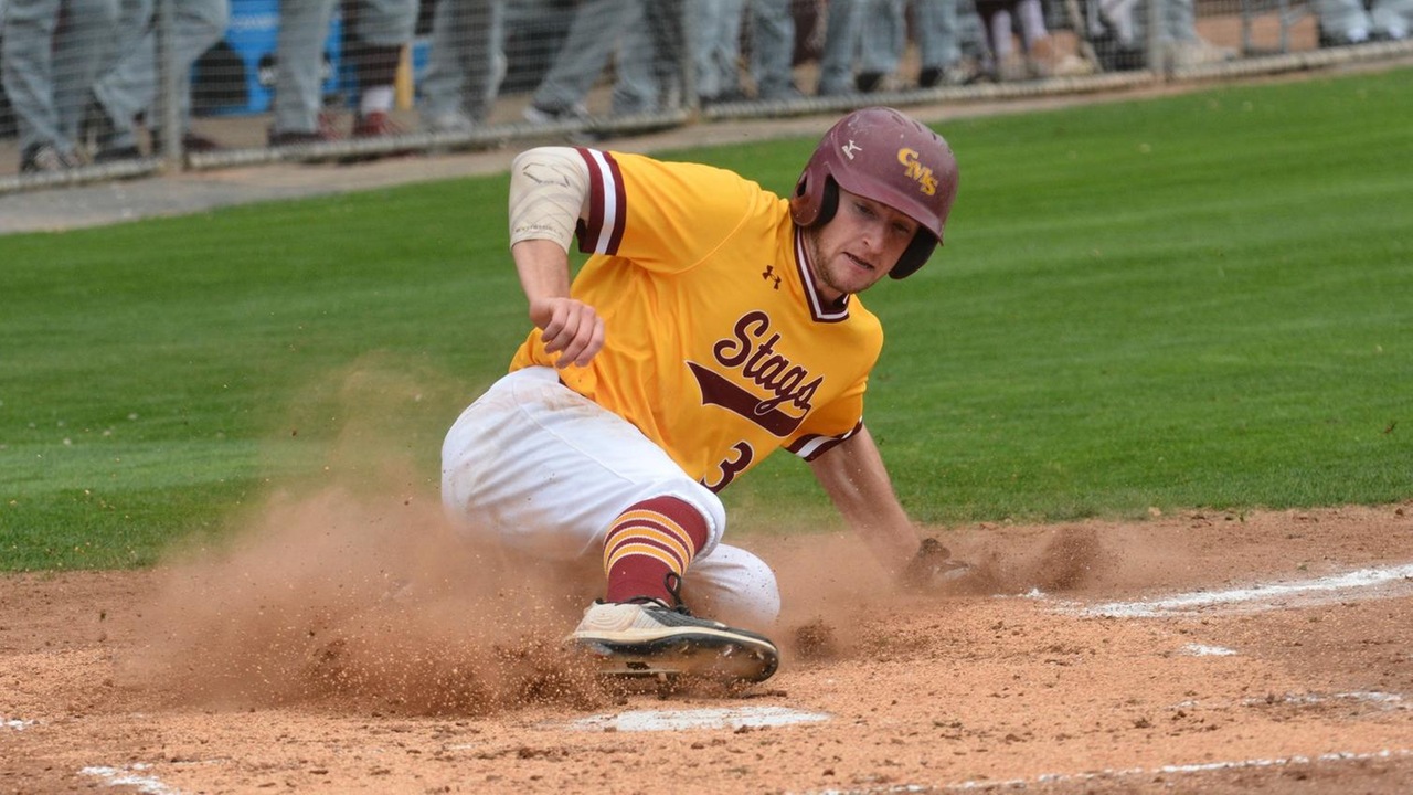 Junior Patrick Gavin slides into home plate with a CMS run