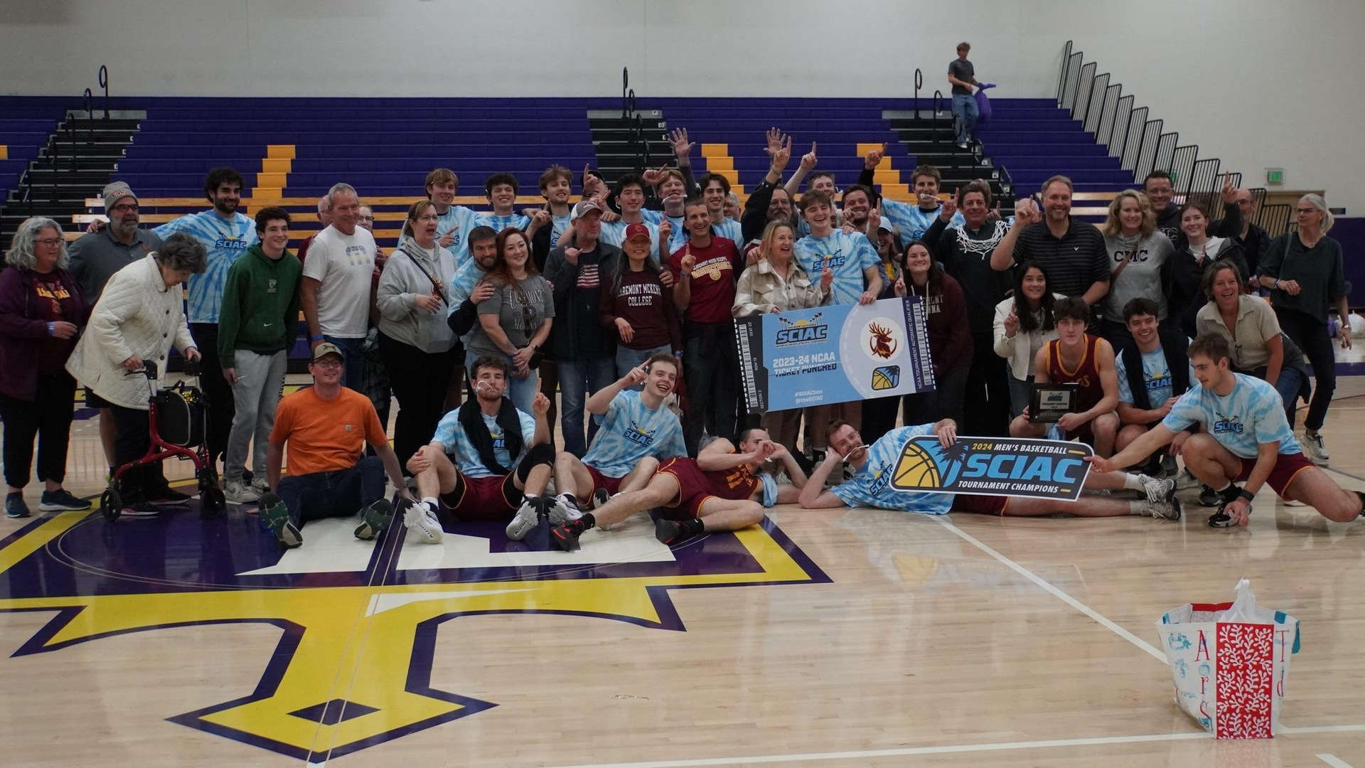 The Stags and their families celebrate the SCIAC title on Saturday