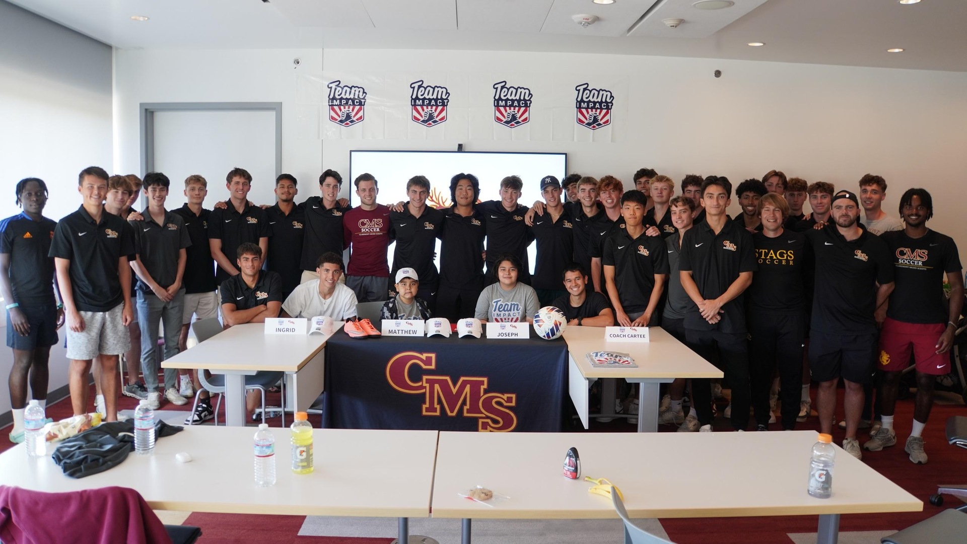 The CMS men's soccer team with Matthew Portillo and Joseph Portillo at their signing ceremony