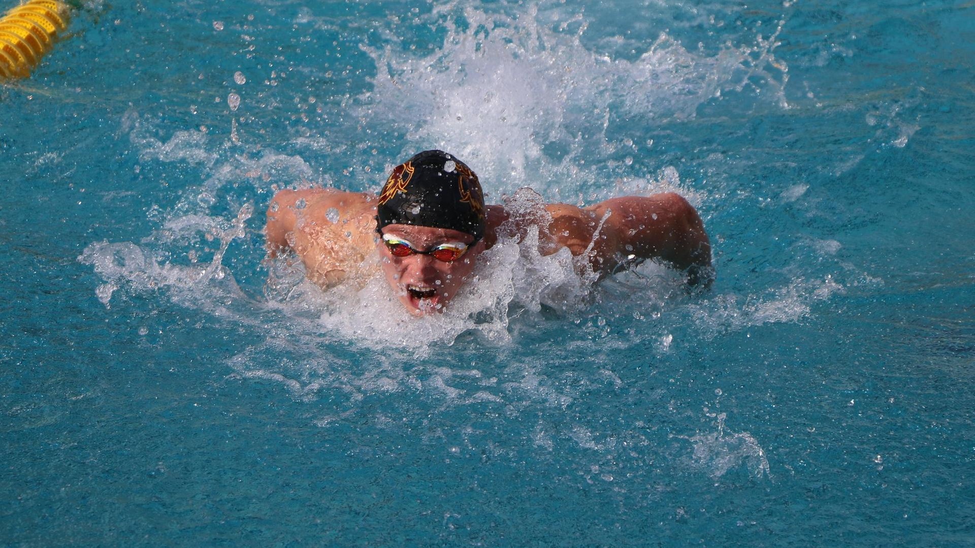 Tyler Headley earned wins in the 100 and 200 fly (photo by Stella Cheng)