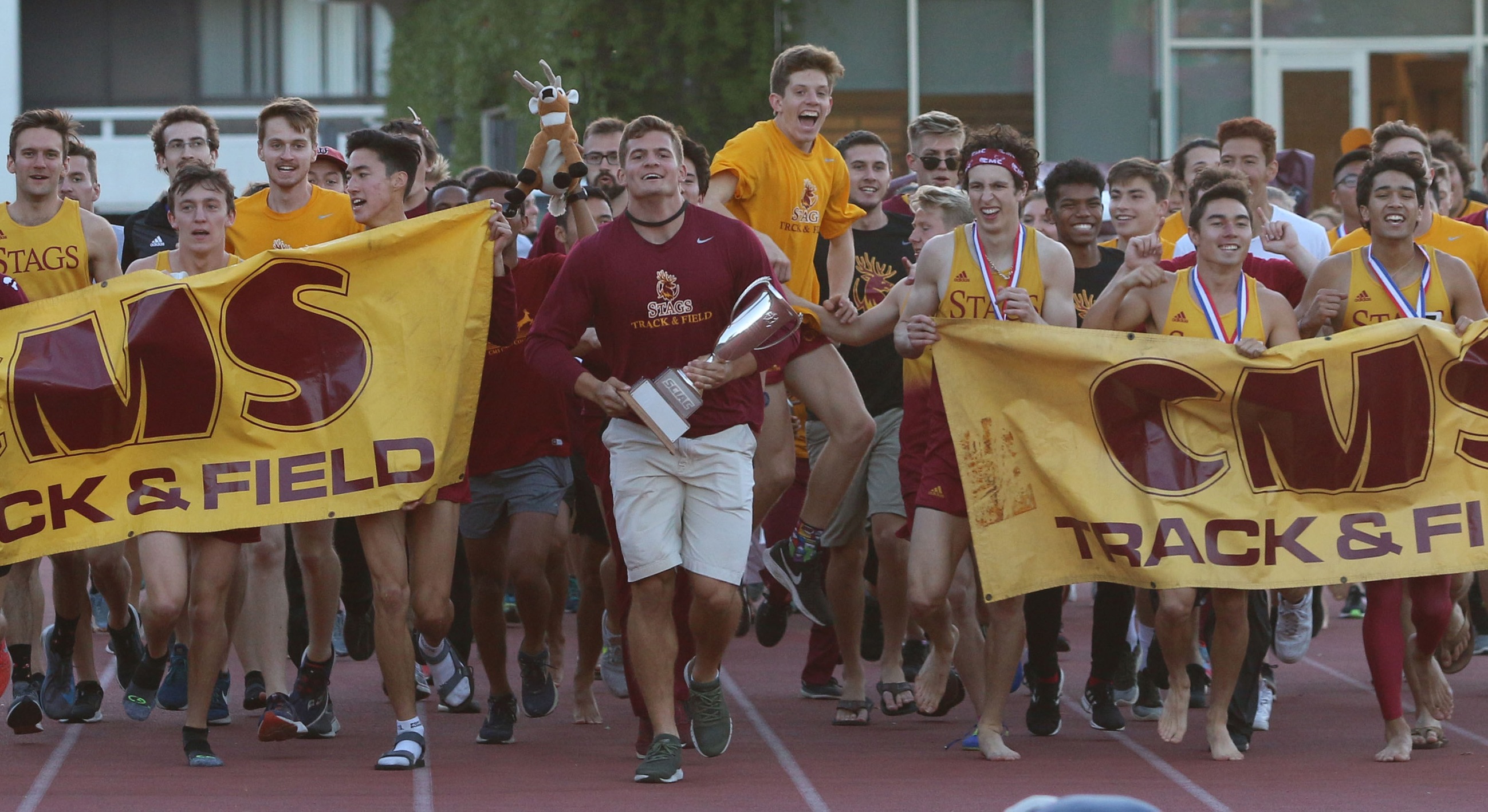 CMS men's track and field celebrating its 2019 SCIAC title