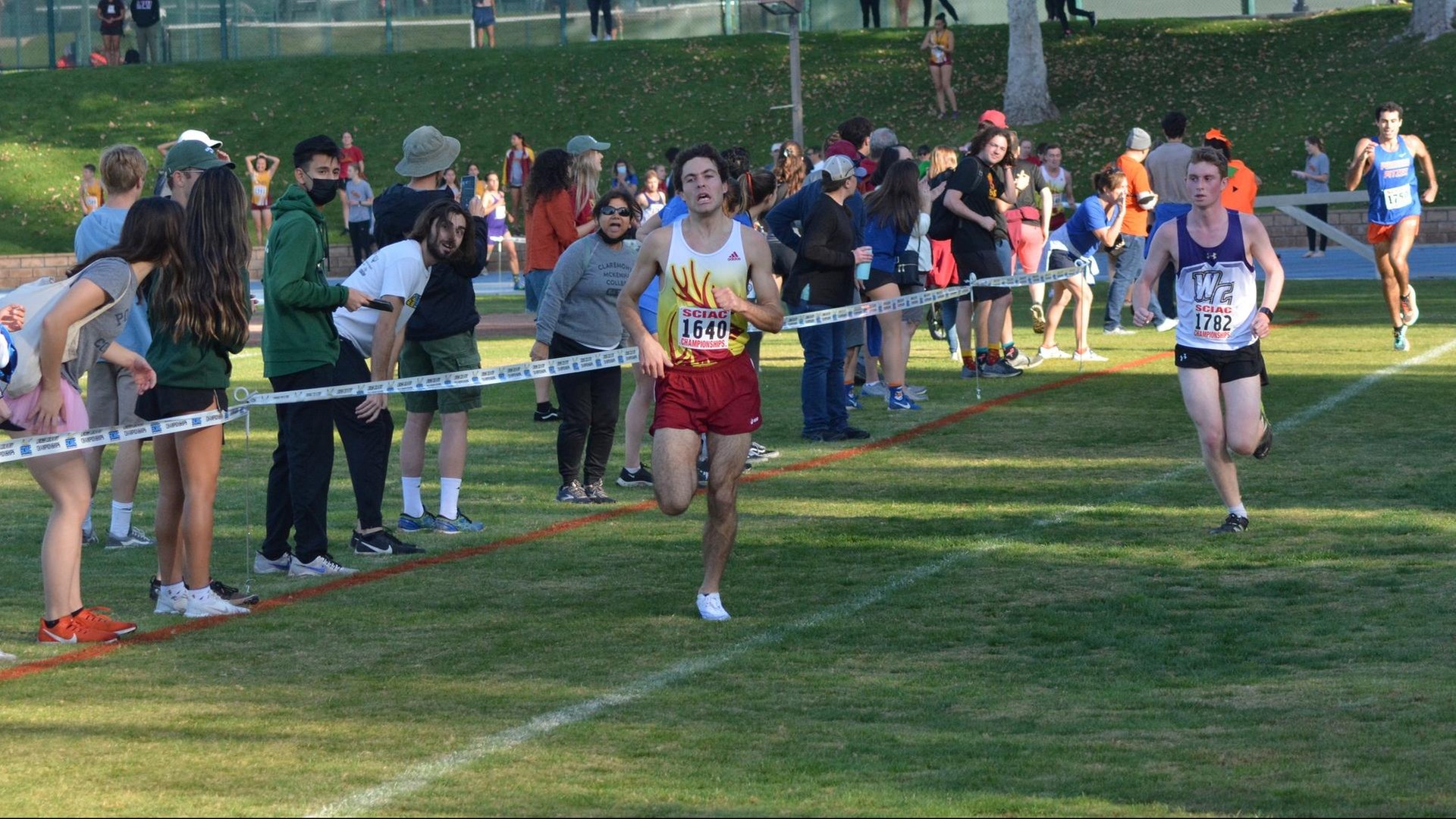 Henry Pick approaches the finish line to win the SCIAC title