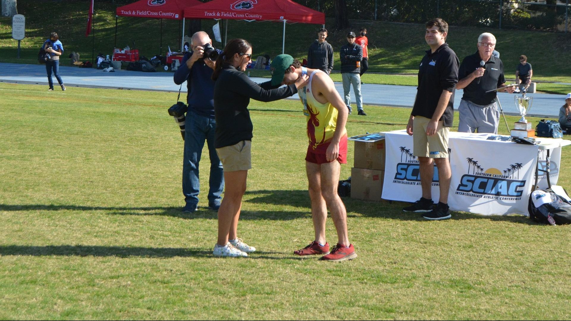 Henry Pick receives his medal after his first-place finish
