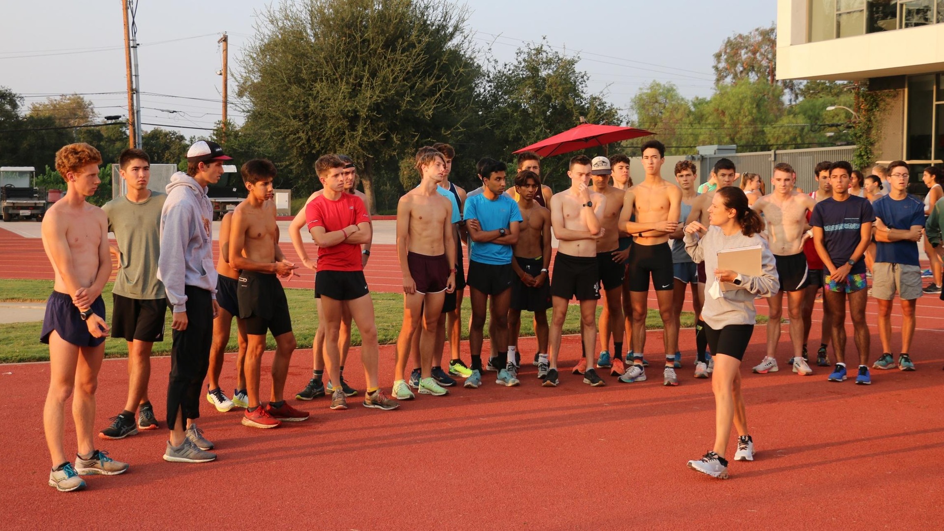 The men's cross country team meets before a recent practice.