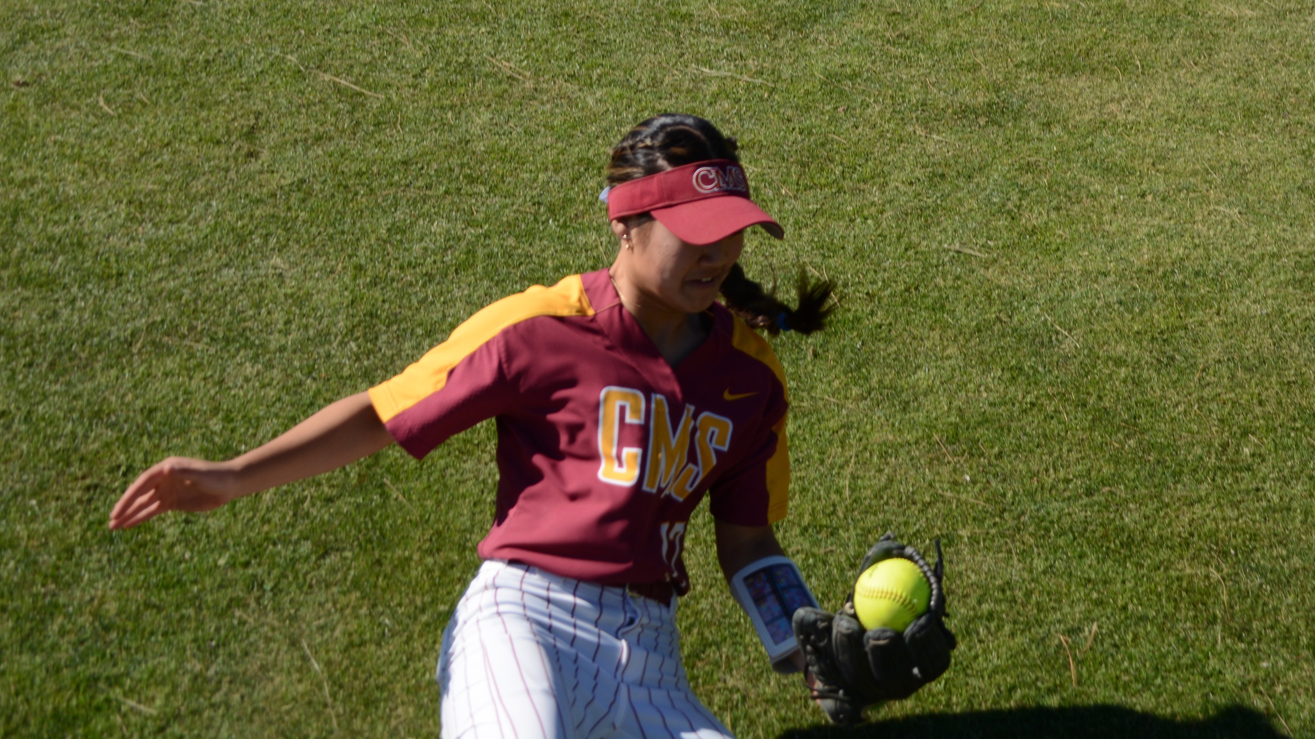 Emma Suh slides to make a catch in foul territory during the opener