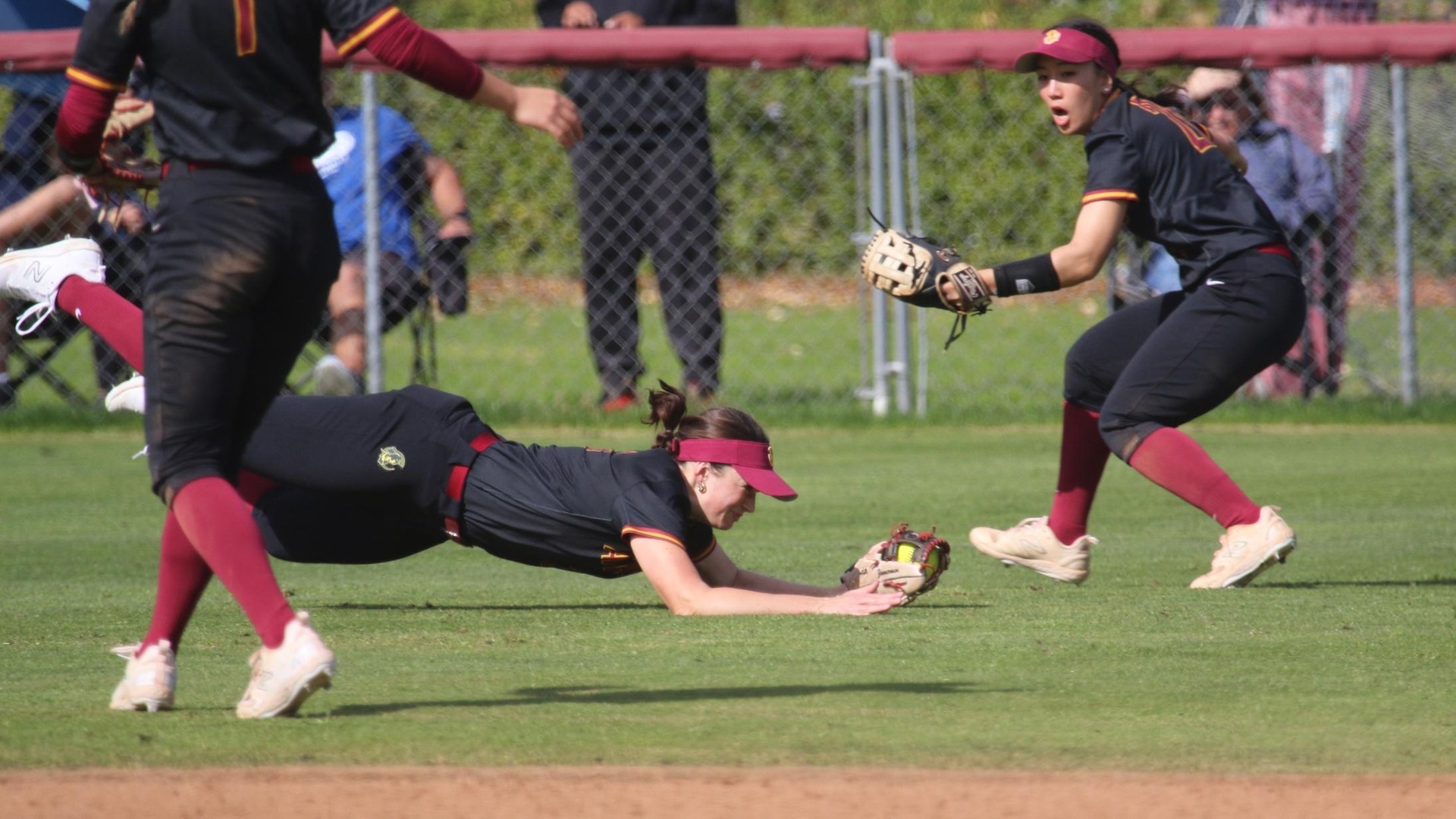 Paige Zimmerman saves a run with a diving catch in center (photo by Eva Fernandez)