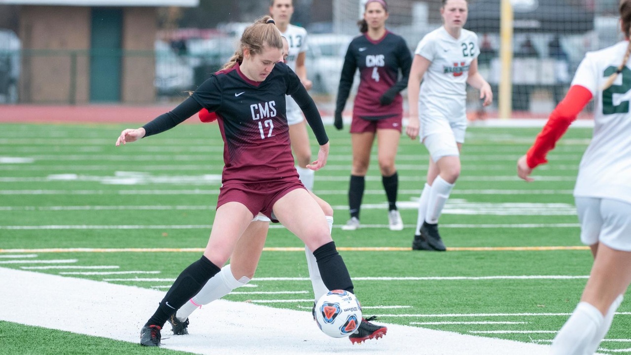 Katrina Ostrom settles the ball in an NCAA Sweet 16 game against WashU