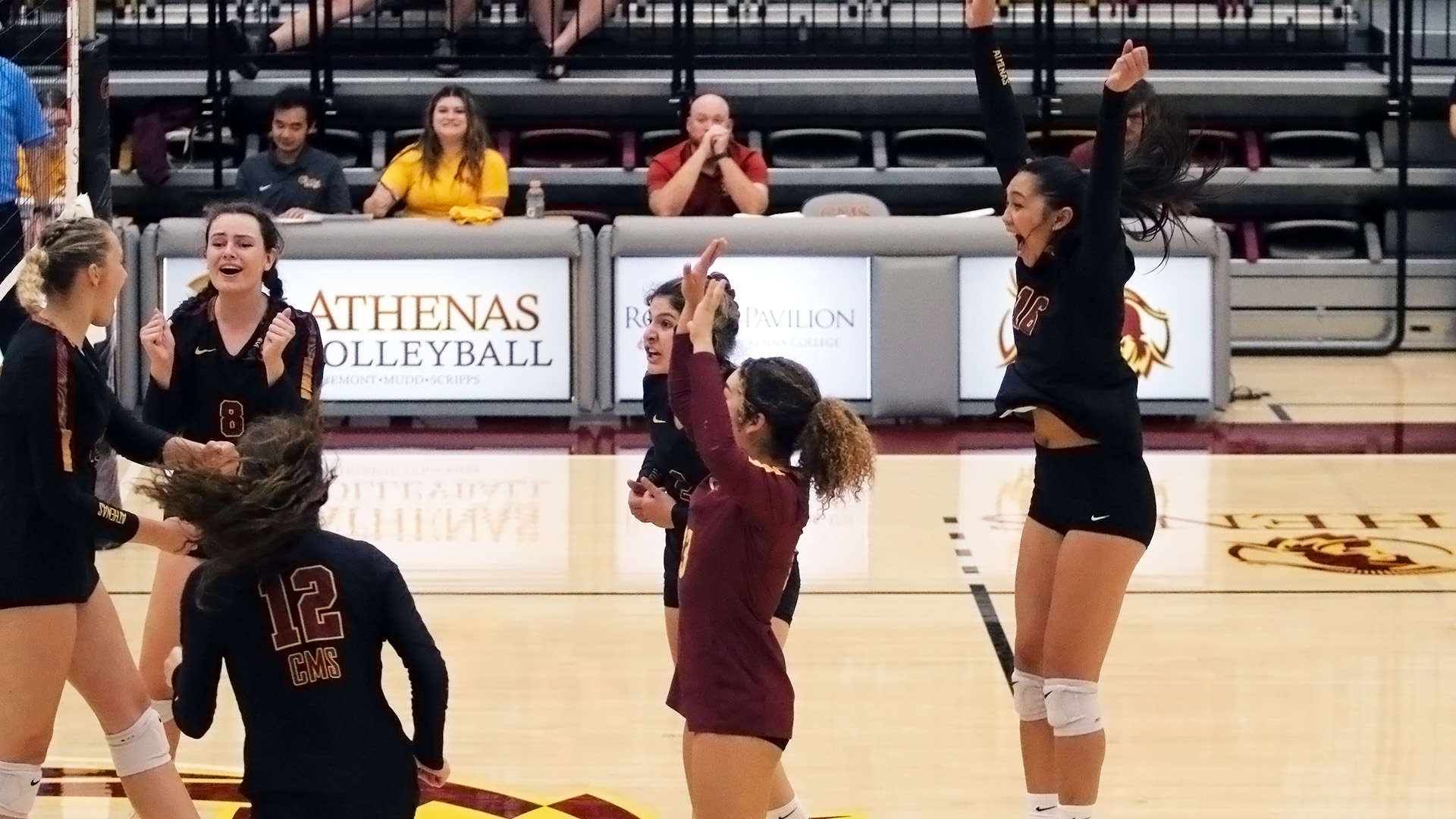 CMS celebrates the first career kill for Solvej Eversoll (left) - photo by Kayla Ishibashi