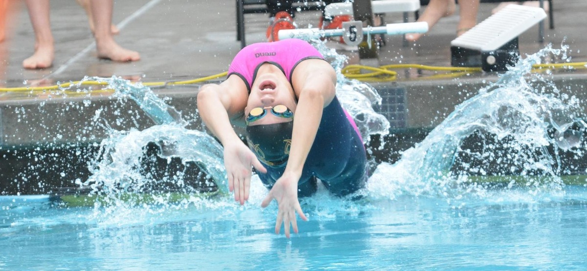 Stephanie Lewis won the 100 back by just three-hundredths of a second