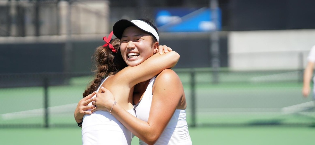 Sydney Lee gets a celebratory hug after her clinching singles win (photo by Alicia Tsai)