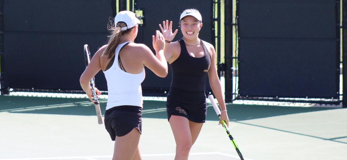 Madison Shea and Sydney Lee celebrate their doubles win over Azusa Pacific on Friday
