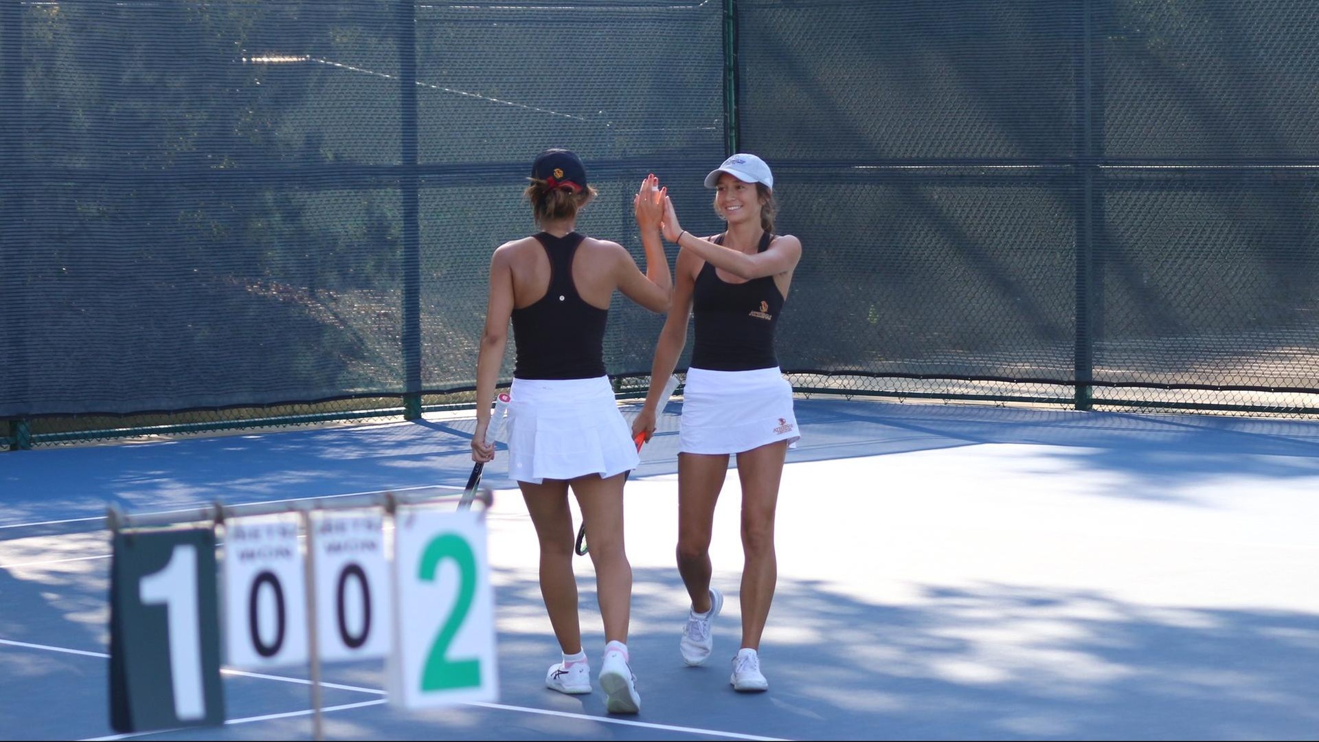 Gabby Lee and Crystal Juan exchanging a high-five