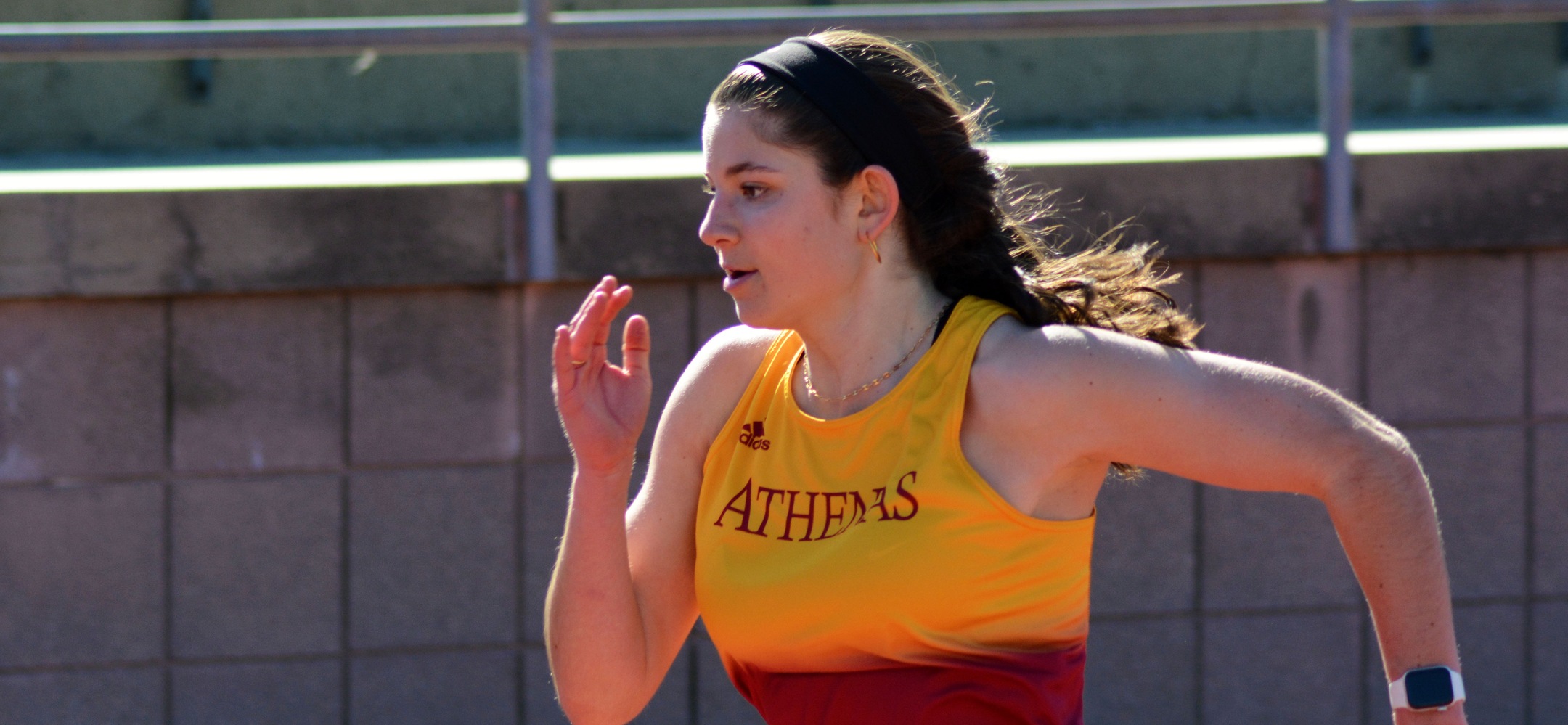 Caroline DelVecchio on her way to a win in the 60-meter hurdles