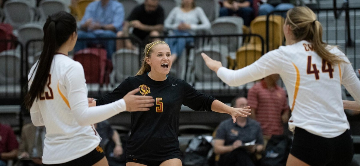 Athenas Sarah Tritschler, Jessica Lee and Phoebe Madsen celebrate after a point