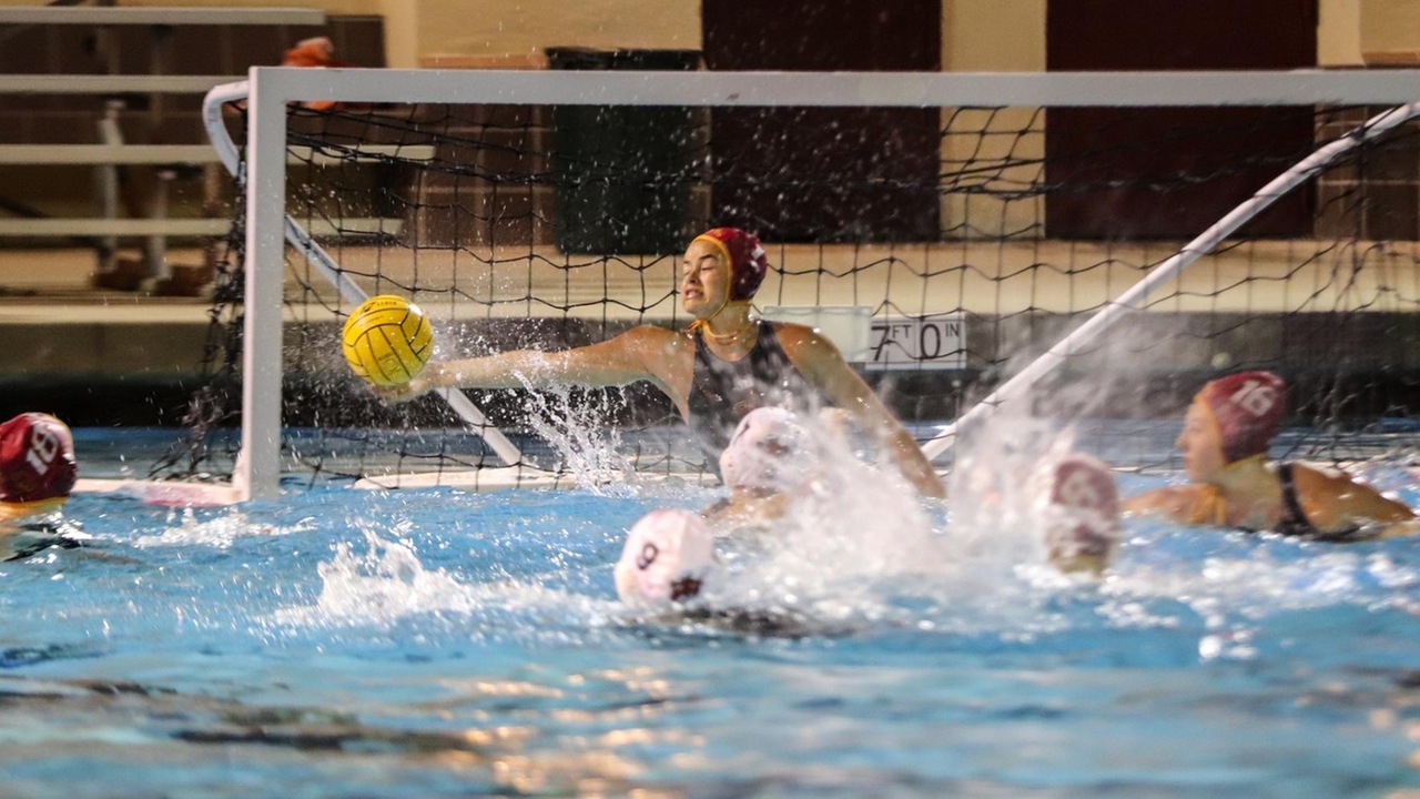 Jessica Salaz with one of her seven saves in the win over Occidental (photo by Daniel Addison)